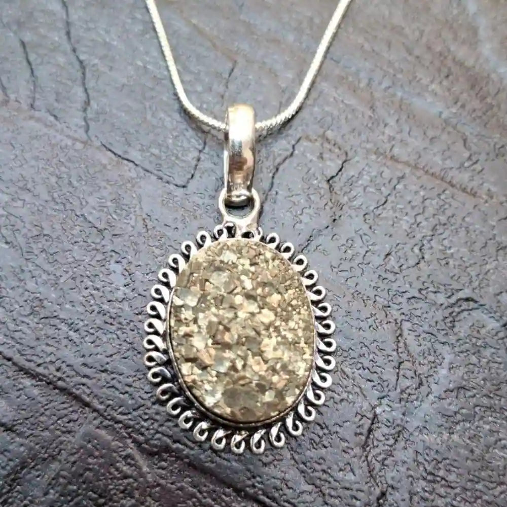 Golden pyrite pendant set in intricate silver frame for a stunning accessory