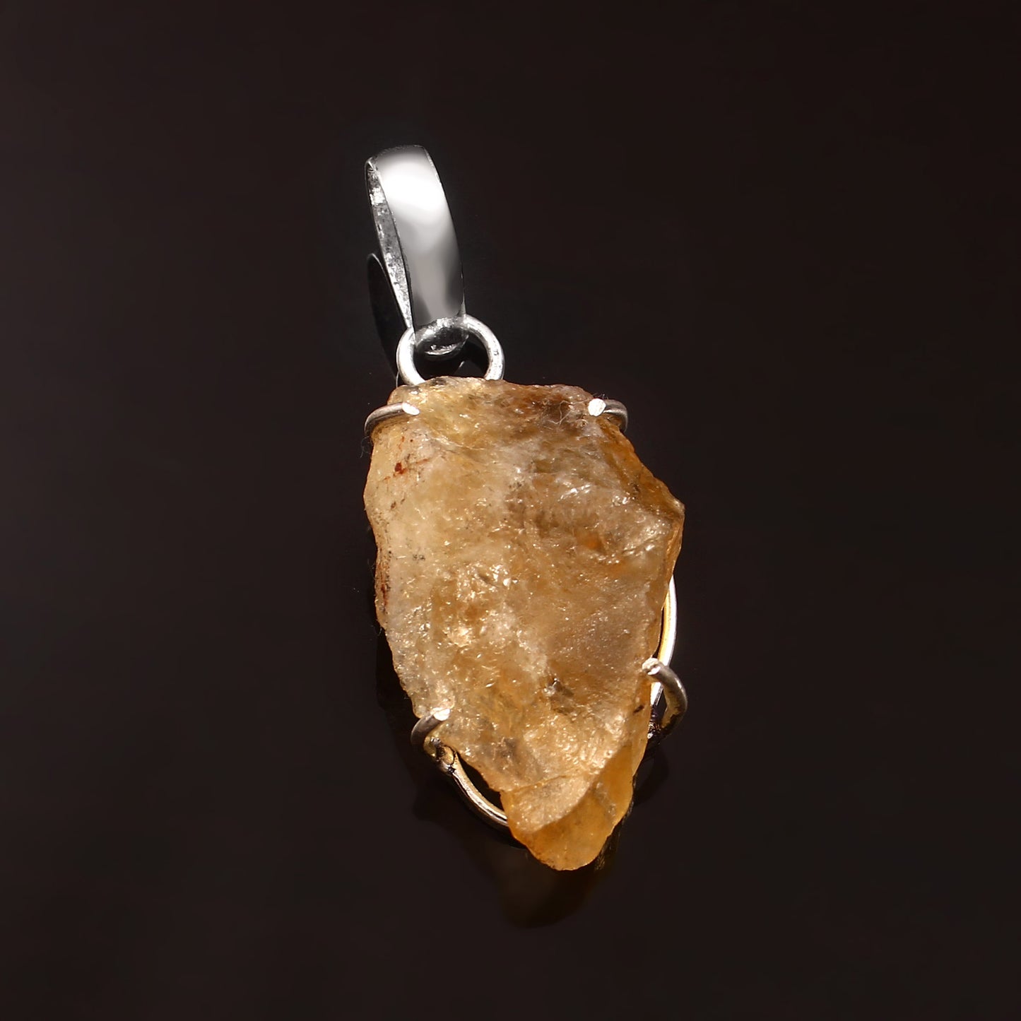 CRYSTCOP natural citrine pendant with raw yellow gemstone set in silver on black background