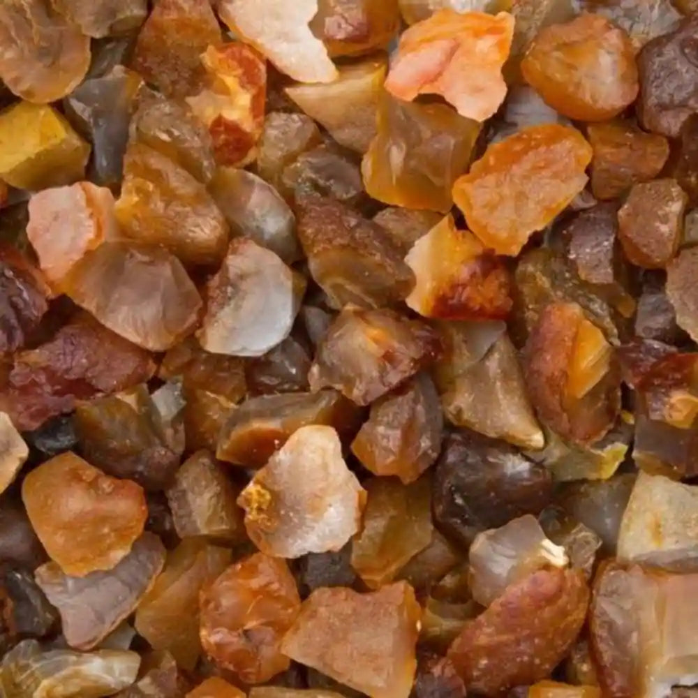 Close-up of raw orange and brown carnelian crystals to buy carnelian crystals in various natural shapes