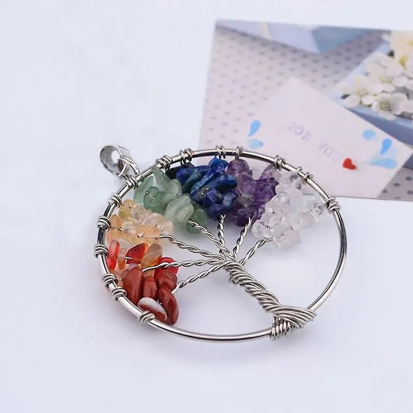 Chakra tree of life pendant with colorful gemstone leaves and silver wire detailing