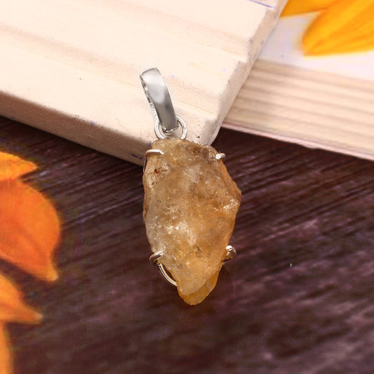 CRYSTCOP natural citrine pendant with rough gemstone and silver setting on wooden background