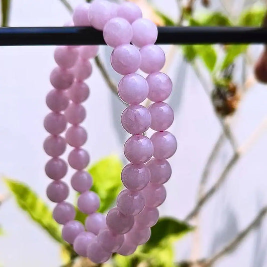 CRYSTCOP pink round beads bracelet made of rose quartz energy jewelry hanging outdoors