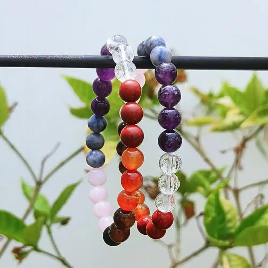 CRYSTCOP colorful gemstone chakra bracelet with round polished beads hanging on black rod